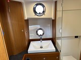Heads with shower over toilet